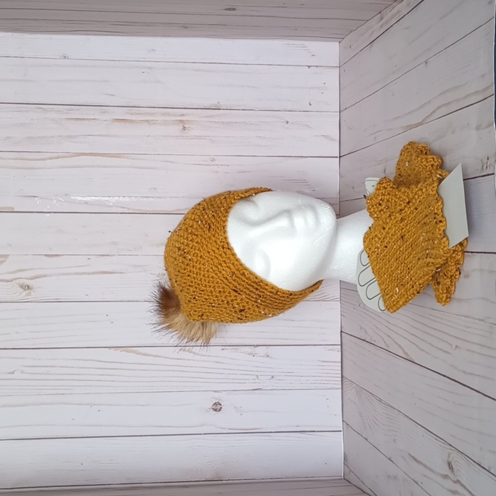 Hand crocheted beanie with a faux fur pom and fingerless glove set.